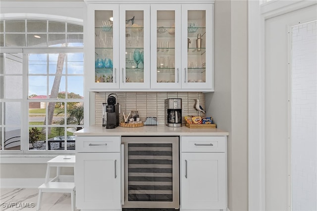 bar featuring white cabinetry and wine cooler