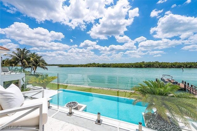 view of swimming pool featuring a water view and a pool