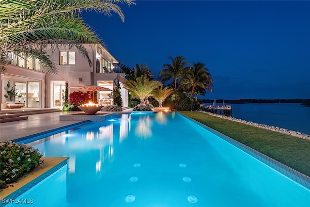 outdoor pool with a water view