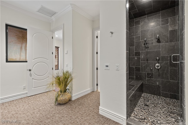 bathroom with ornamental molding and walk in shower