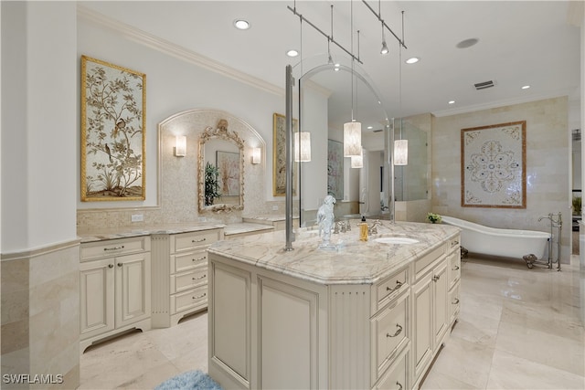 bathroom featuring ornamental molding, vanity, tile walls, and a bathing tub