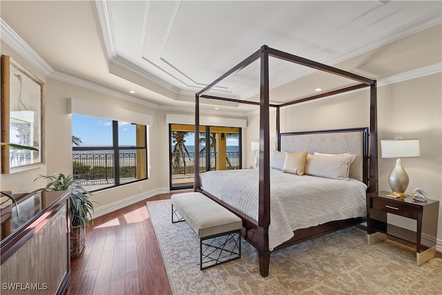 bedroom featuring hardwood / wood-style flooring and crown molding