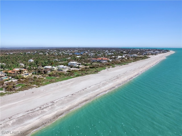 aerial view with a beach view and a water view