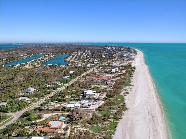 aerial view featuring a water view and a beach view