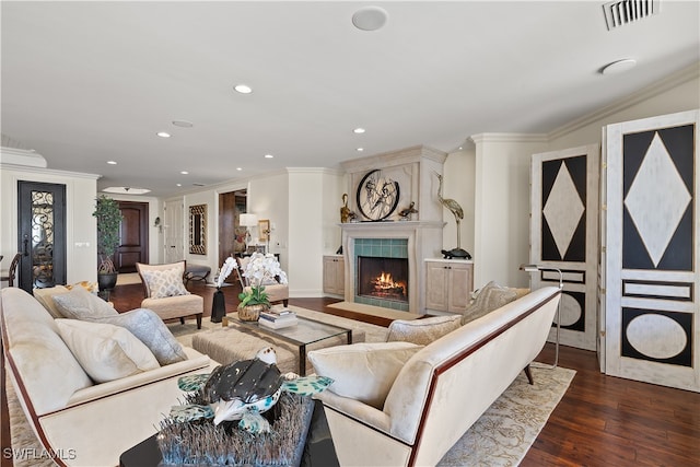 living room featuring dark hardwood / wood-style flooring and crown molding