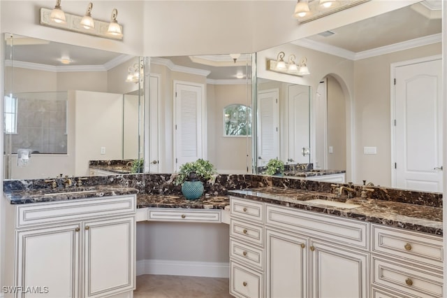 bathroom with a shower, vanity, and ornamental molding