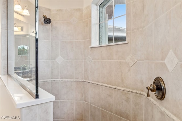 bathroom with a tile shower