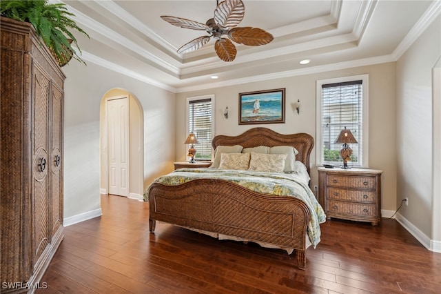 bedroom with dark hardwood / wood-style floors, multiple windows, and ceiling fan