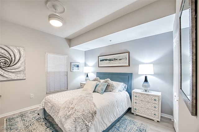 bedroom with wood-type flooring