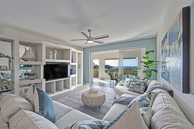 living room with ceiling fan and hardwood / wood-style floors