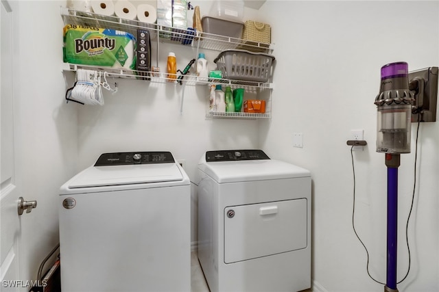 washroom with washer and clothes dryer