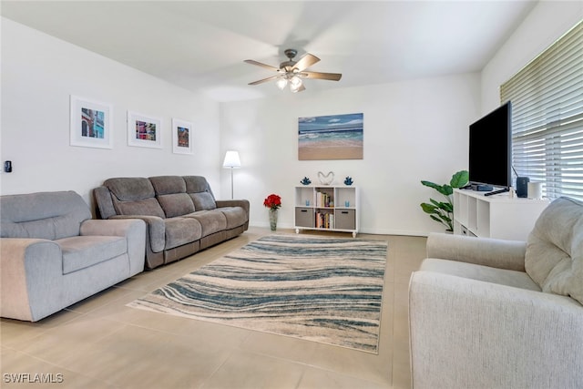 tiled living room with ceiling fan