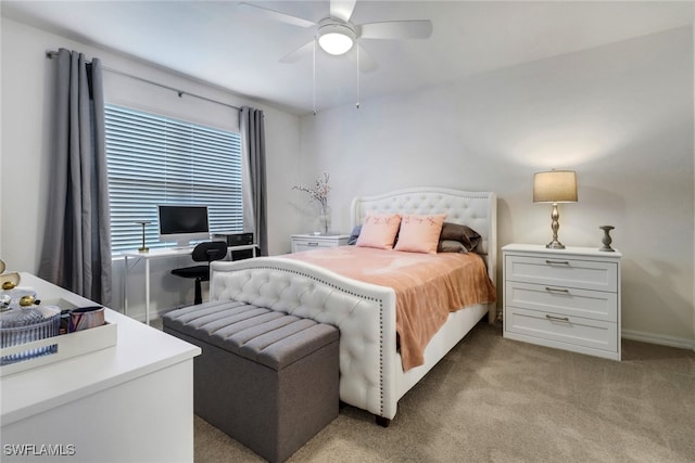 bedroom with ceiling fan and light carpet