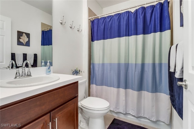 full bathroom featuring tile patterned flooring, vanity, toilet, and shower / bath combo with shower curtain