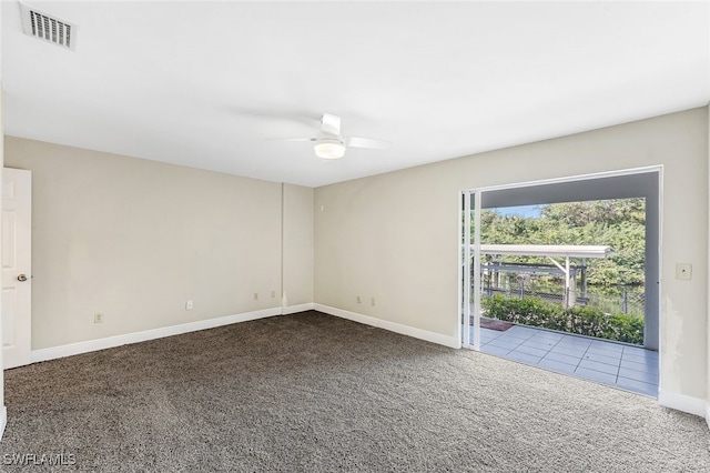 unfurnished room with carpet flooring and ceiling fan