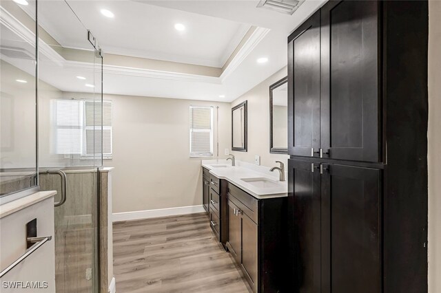 2199 Santiago Ave, Fort Myers, FL 33905 - bathroom with double vanity, crown molding, wood finished floors, baseboards, and recessed lighting