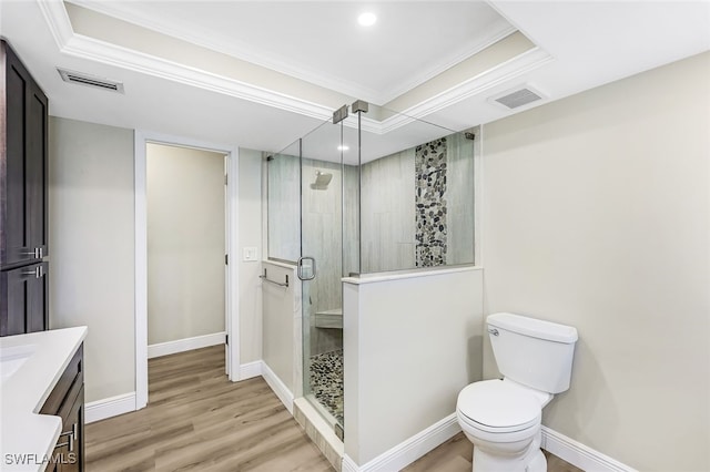 2199 Santiago Ave, Fort Myers, FL 33905 - bathroom featuring ornamental molding, a stall shower, vanity, wood finished floors, and toilet