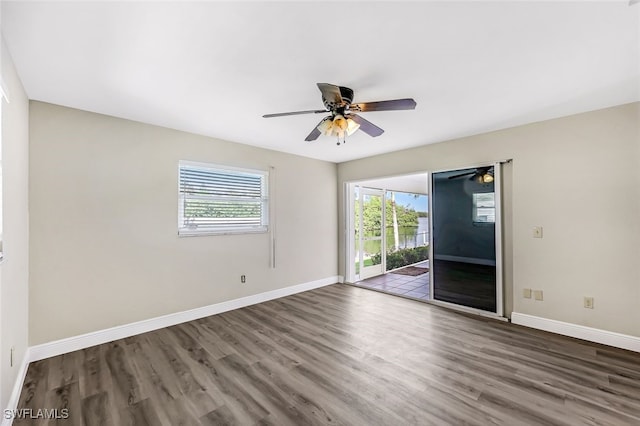 2199 Santiago Ave, Fort Myers, FL 33905 - empty room featuring a ceiling fan, wood finished floors, and baseboards