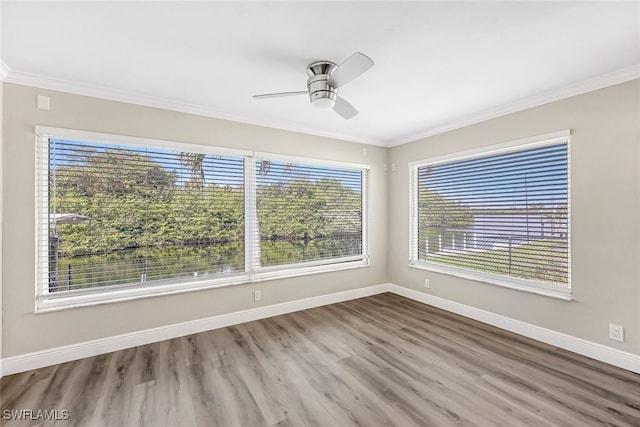 2199 Santiago Ave, Fort Myers, FL 33905 - spare room featuring wood finished floors, baseboards, a ceiling fan, and crown molding