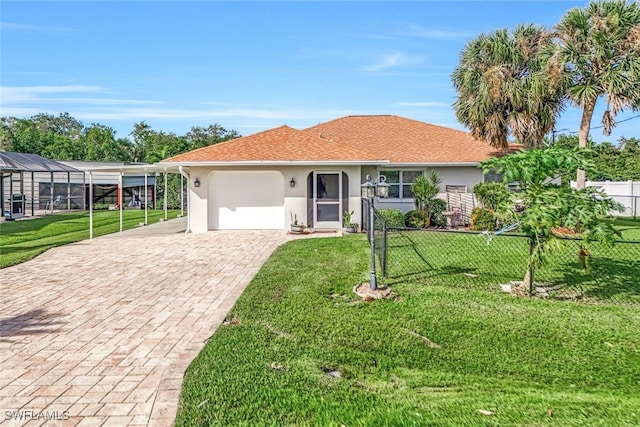 view of front of home featuring a front yard and a garage