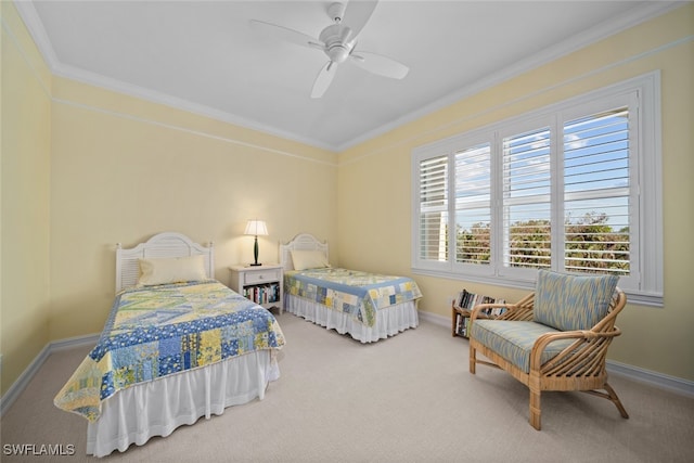 carpeted bedroom featuring ceiling fan and ornamental molding