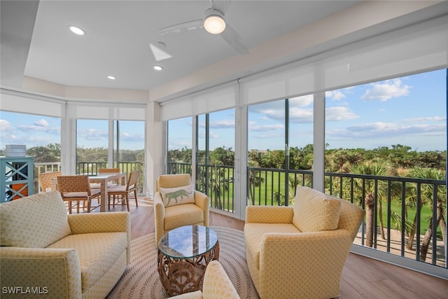 sunroom featuring ceiling fan