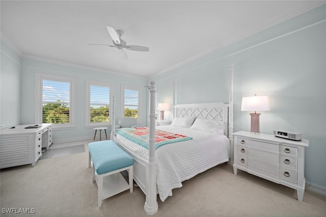 carpeted bedroom featuring ceiling fan and ornamental molding