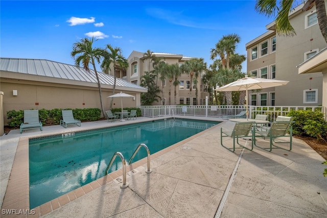 view of swimming pool featuring a patio area