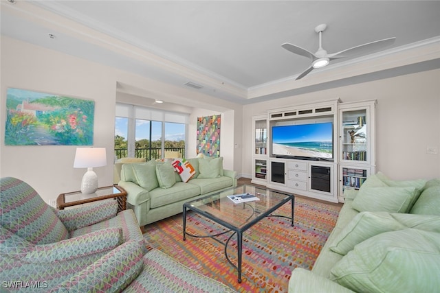 living room featuring crown molding and ceiling fan