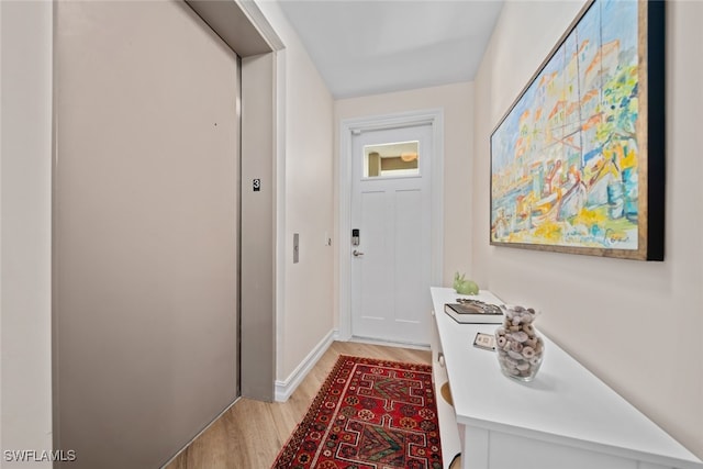 doorway to outside featuring light wood-type flooring