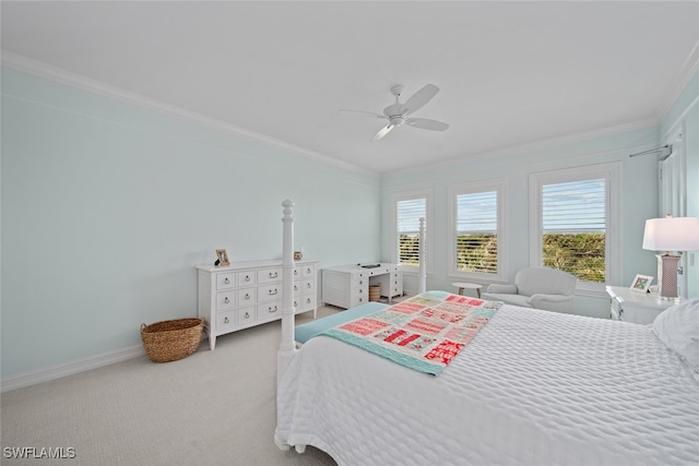 bedroom featuring ceiling fan, crown molding, and carpet floors