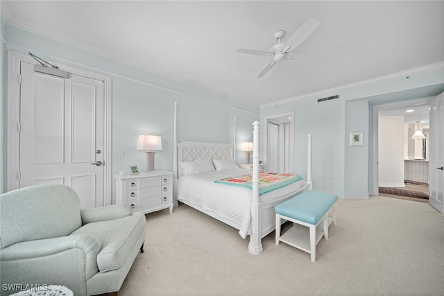 bedroom featuring ceiling fan, crown molding, and light carpet