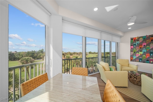 sunroom / solarium with ceiling fan and a healthy amount of sunlight