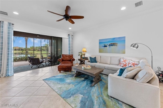 tiled living room with ceiling fan and crown molding