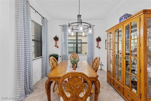 dining space featuring a chandelier and ornamental molding