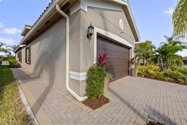 view of side of property featuring a garage