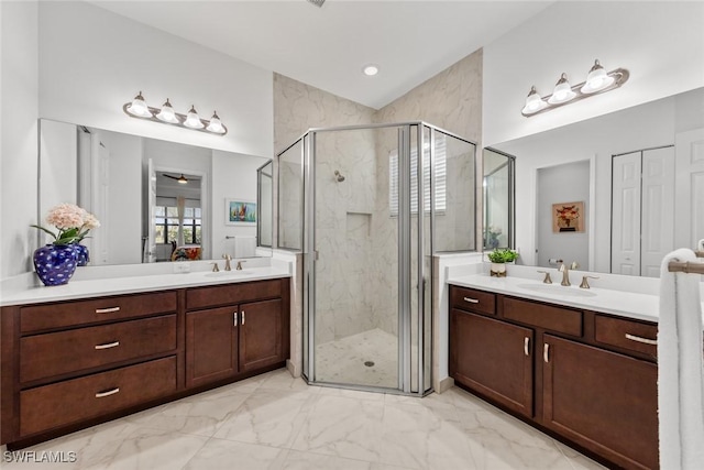 bathroom with vanity, ceiling fan, and an enclosed shower