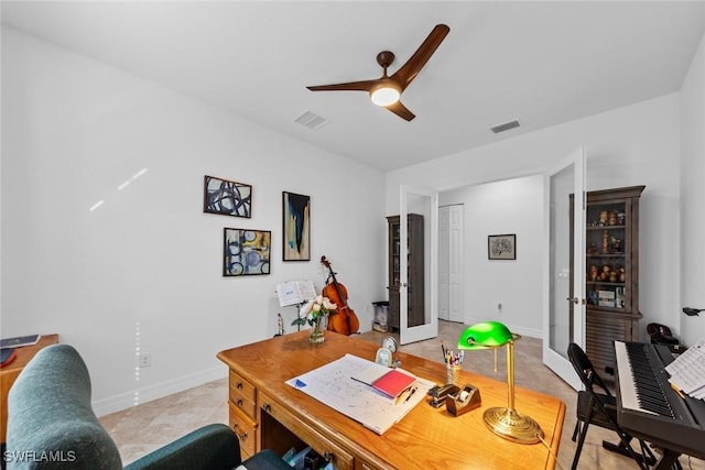 office space featuring french doors, light tile patterned floors, and ceiling fan