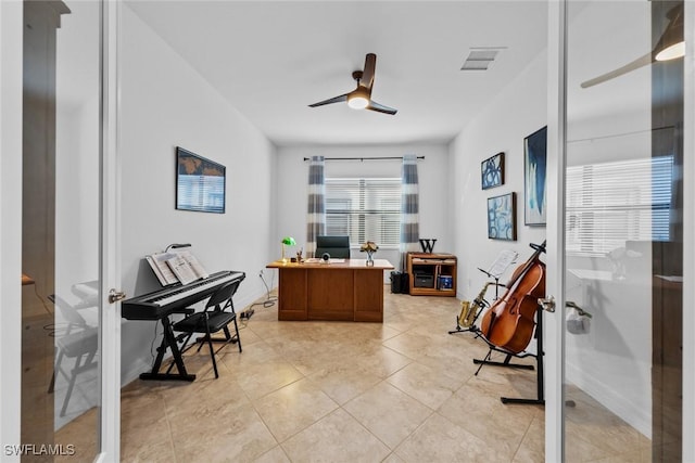 office area featuring french doors, light tile patterned floors, and ceiling fan