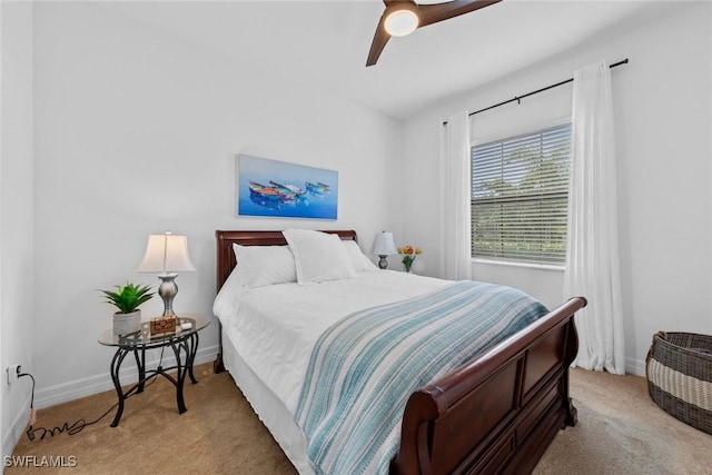 bedroom with ceiling fan and light colored carpet