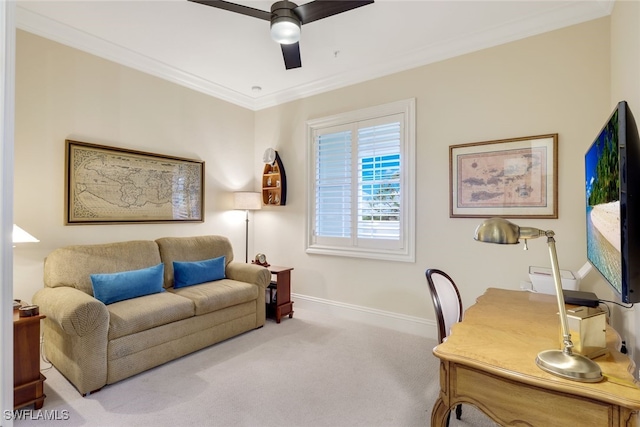 carpeted office featuring ceiling fan and crown molding