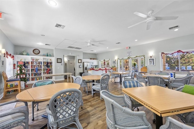 dining room with ceiling fan, visible vents, wood finished floors, and recessed lighting