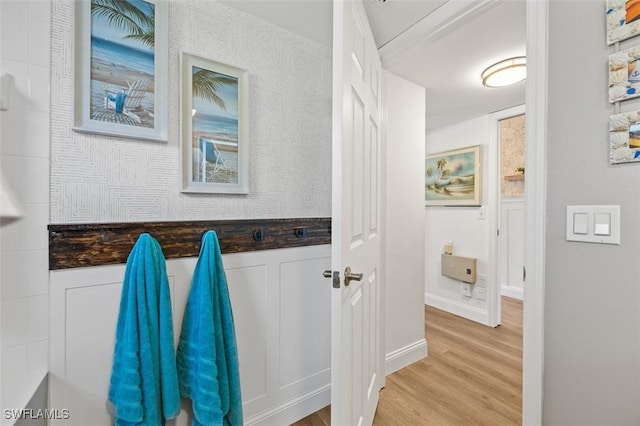 bathroom featuring wood finished floors and baseboards