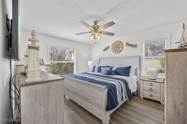 bedroom with ceiling fan and wood finished floors