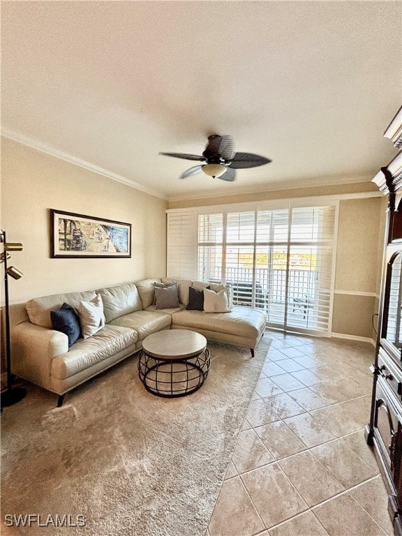 living room with a textured ceiling, ceiling fan, and ornamental molding