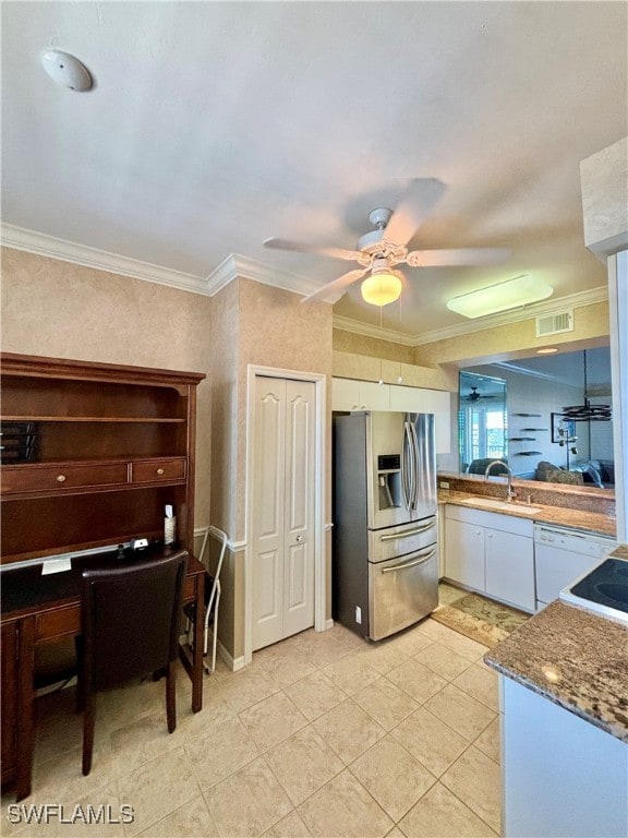 kitchen with ceiling fan, white cabinetry, stainless steel refrigerator with ice dispenser, and ornamental molding