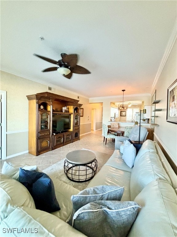 living room featuring ceiling fan and crown molding