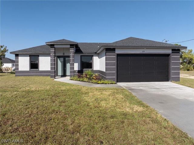 prairie-style home with a garage and a front lawn