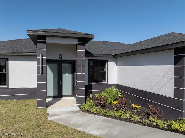 entrance to property featuring french doors