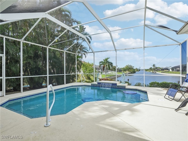 view of pool featuring glass enclosure, pool water feature, a water view, and a patio